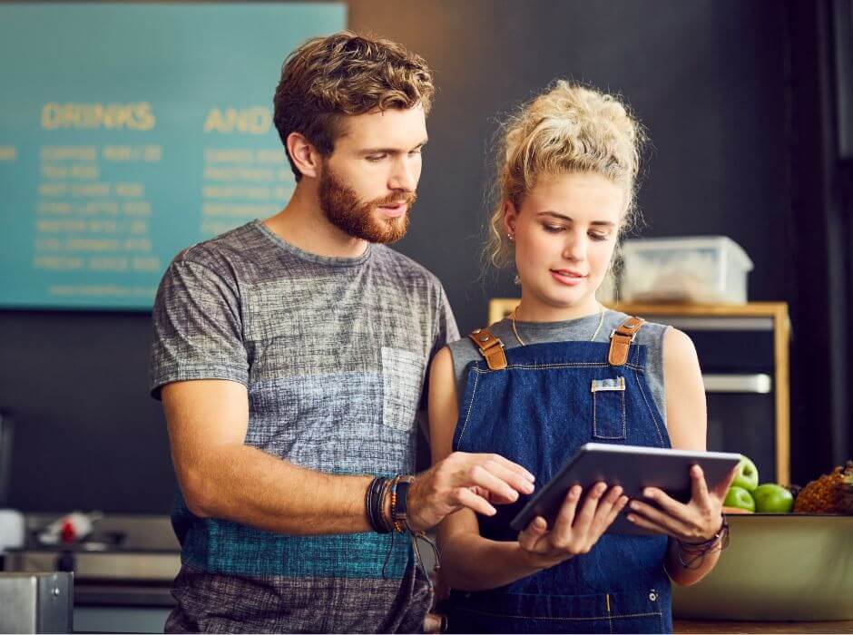 Cafe staff using ipad