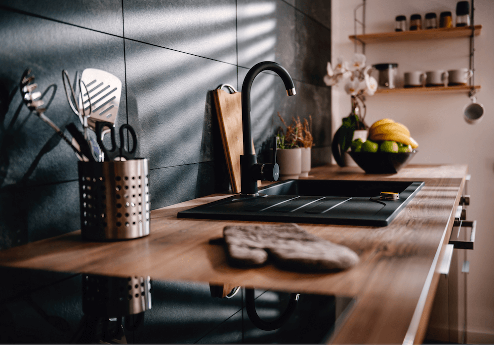 Kitchen counter with sink and cook top